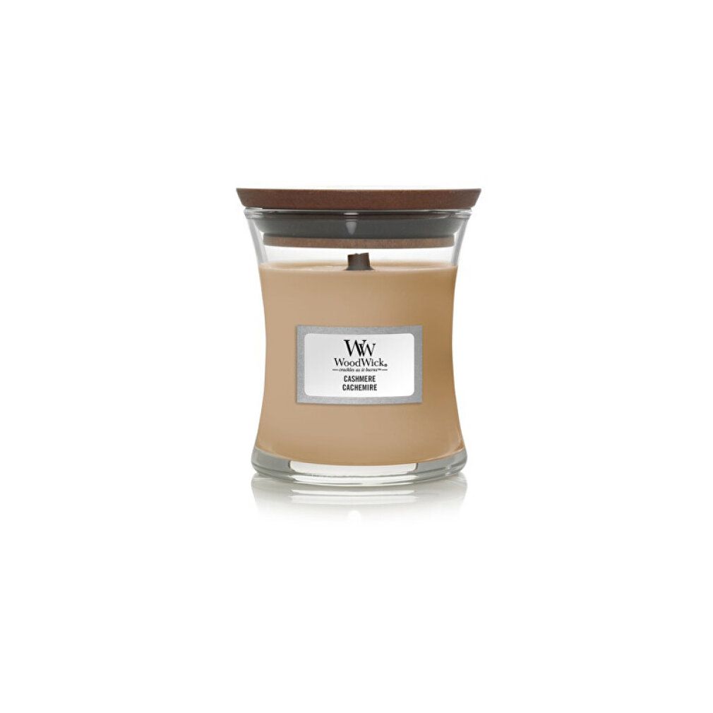 Sanduhrförmige Kerze mit Holzdeckel. Beige Wachs, Glasbehälter. Etikett mit "WoodWick" und "Cashmere".