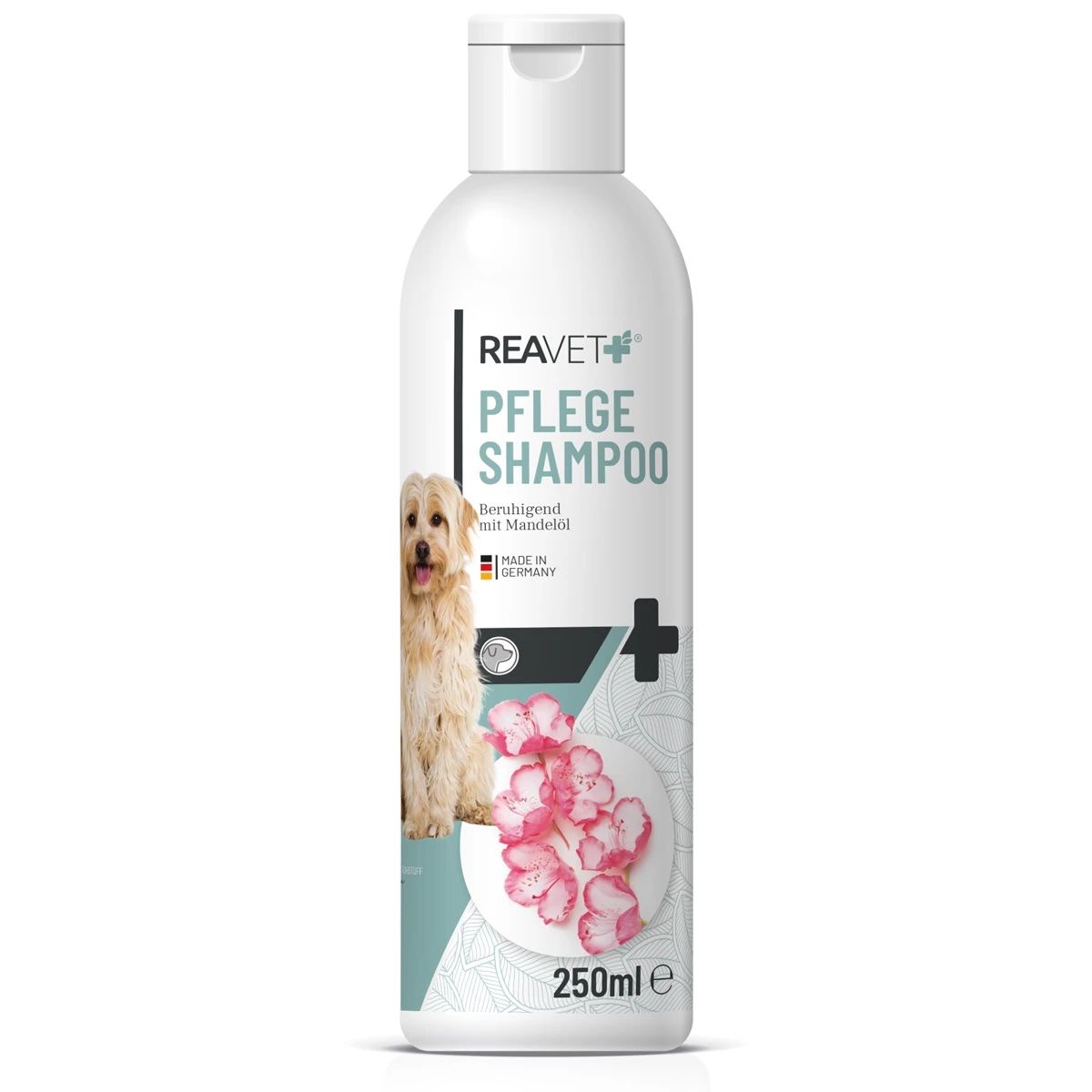 Weiße Flasche mit Etikett. Text: REAVET, Pflege Shampoo. Abbildung eines Hundes und rosa Blüten. 250ml.