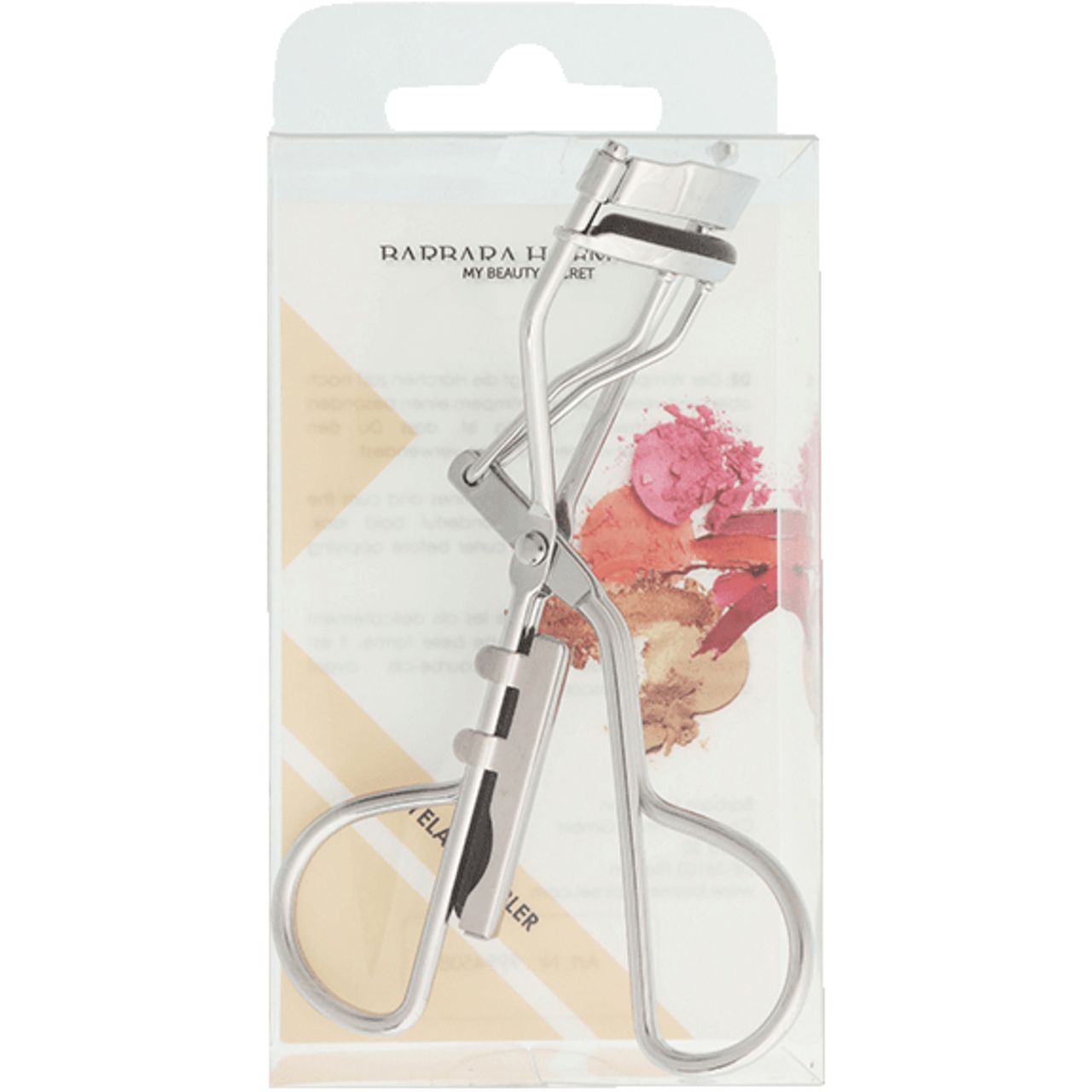 Wimpernformer in transparenter Verpackung. Metallfarben, mit Griffen und Gummipolsterung. Marke sichtbar.