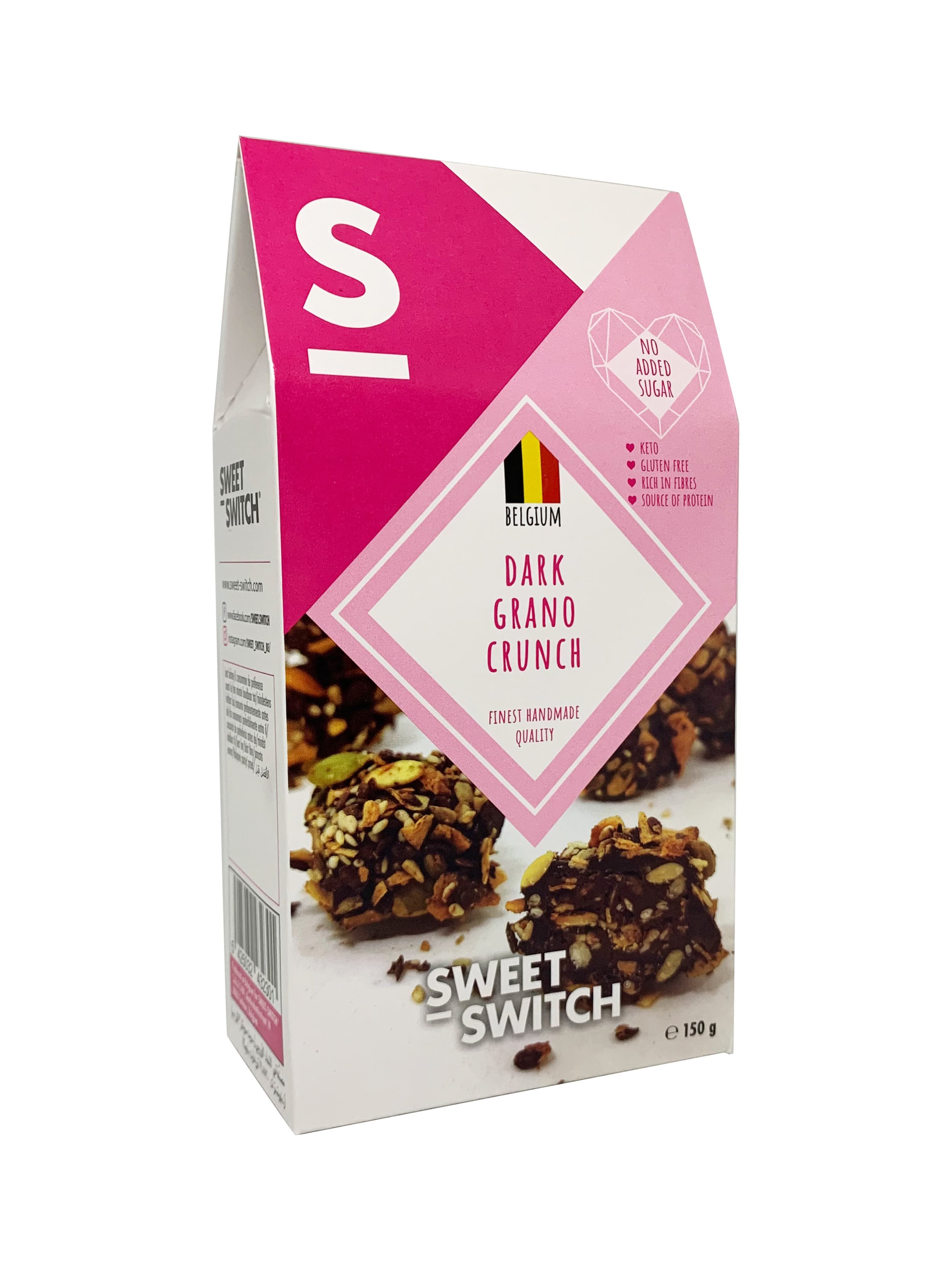 Verpackung mit "Sweet Switch Dark Grano Crunch Balls". Rosa-weißes Design, Produktname, belgische Flagge, "No added sugar".