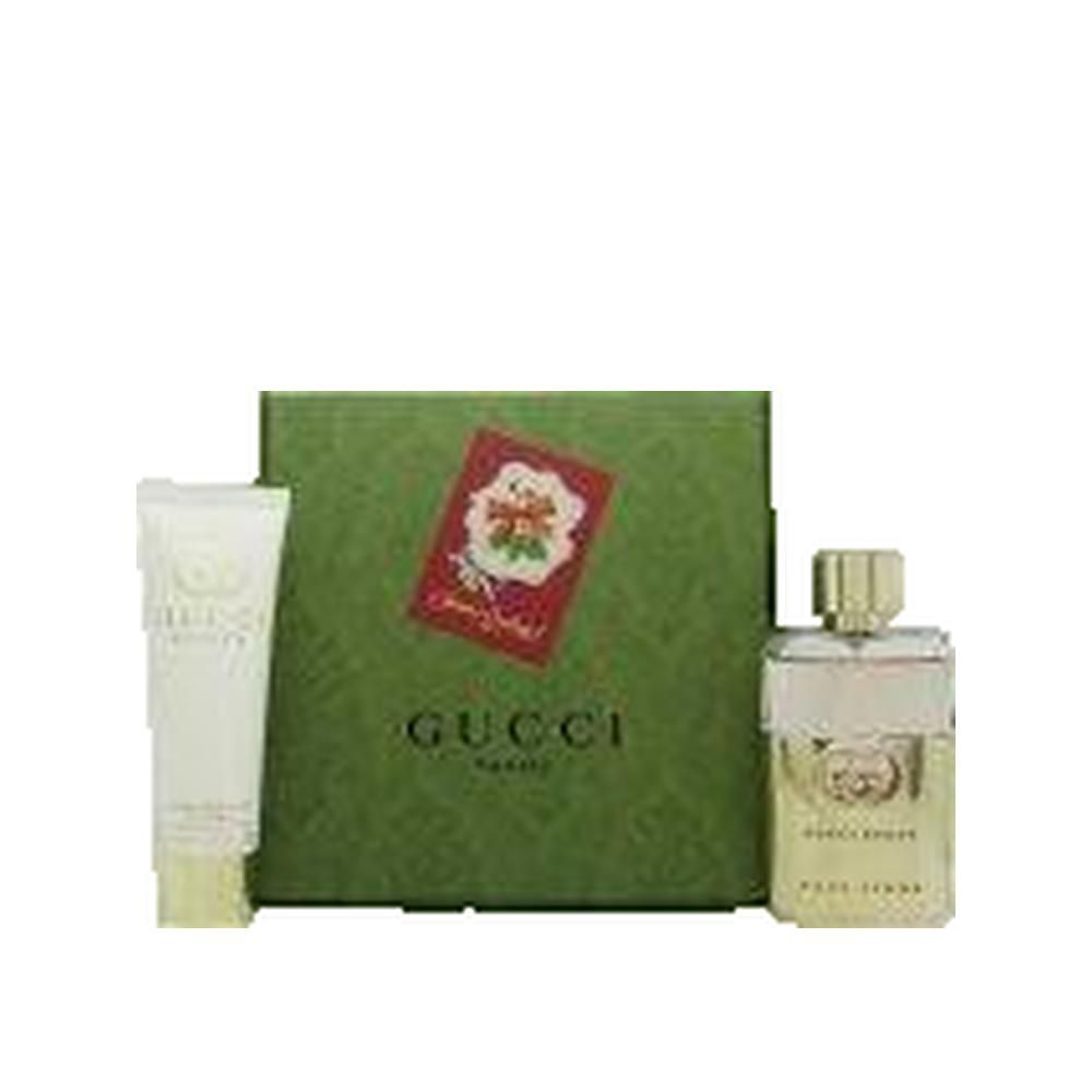 Geschenkset mit Parfum, Lotion und grüner Schachtel. Gucci-Logo und Produktname auf der Flasche.