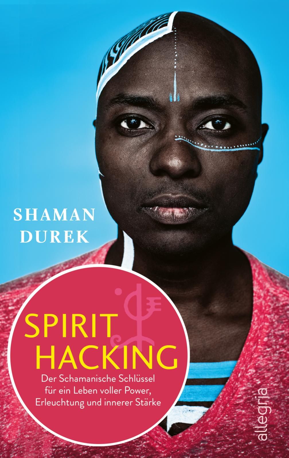 Buchcover mit Porträt einer Person. Titel: SPIRIT HACKING. Autor: Shaman Durek. Roter Kreis mit gelber Schrift.