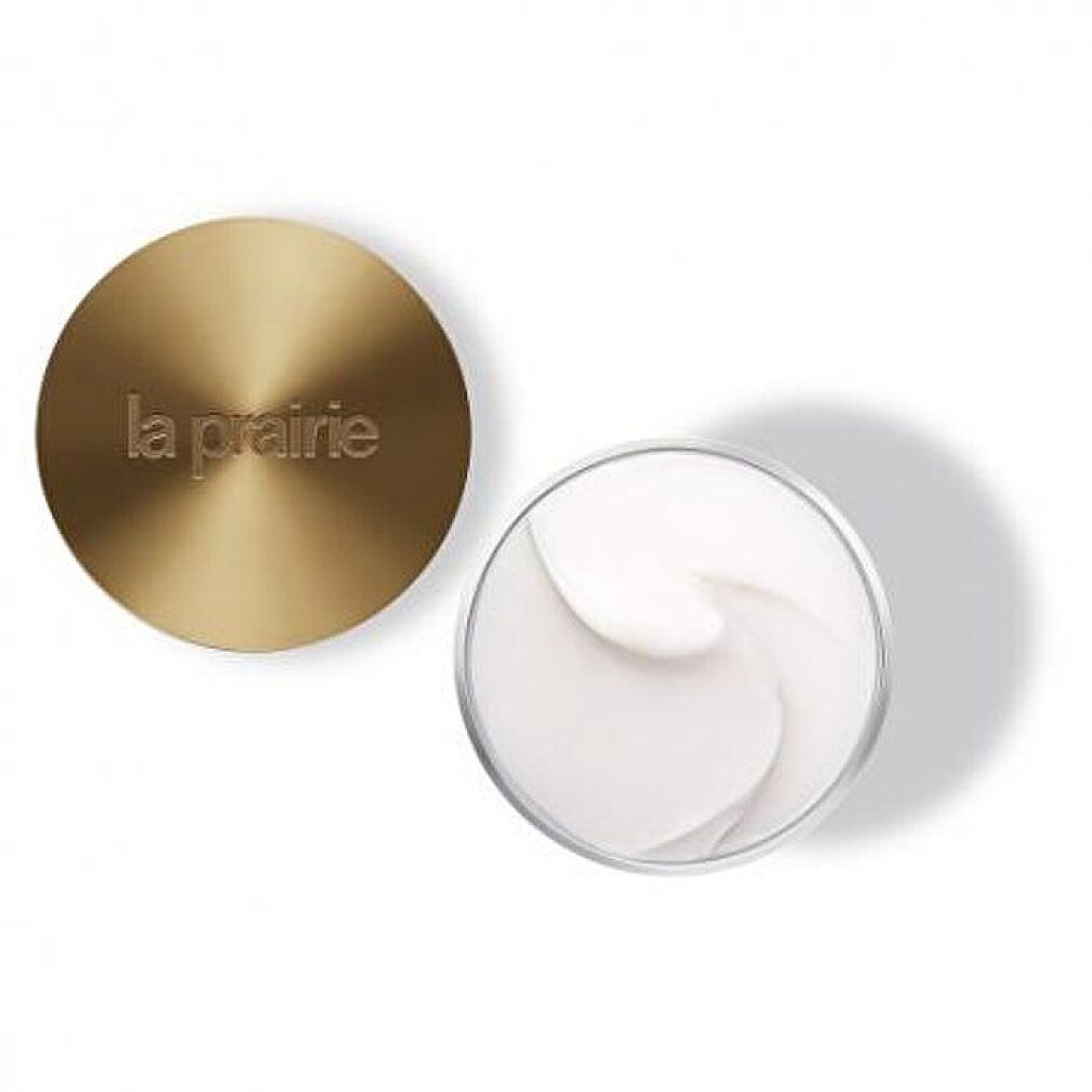 Goldfarbener Deckel und Tiegel mit Creme. Auf dem Deckel steht "la prairie".