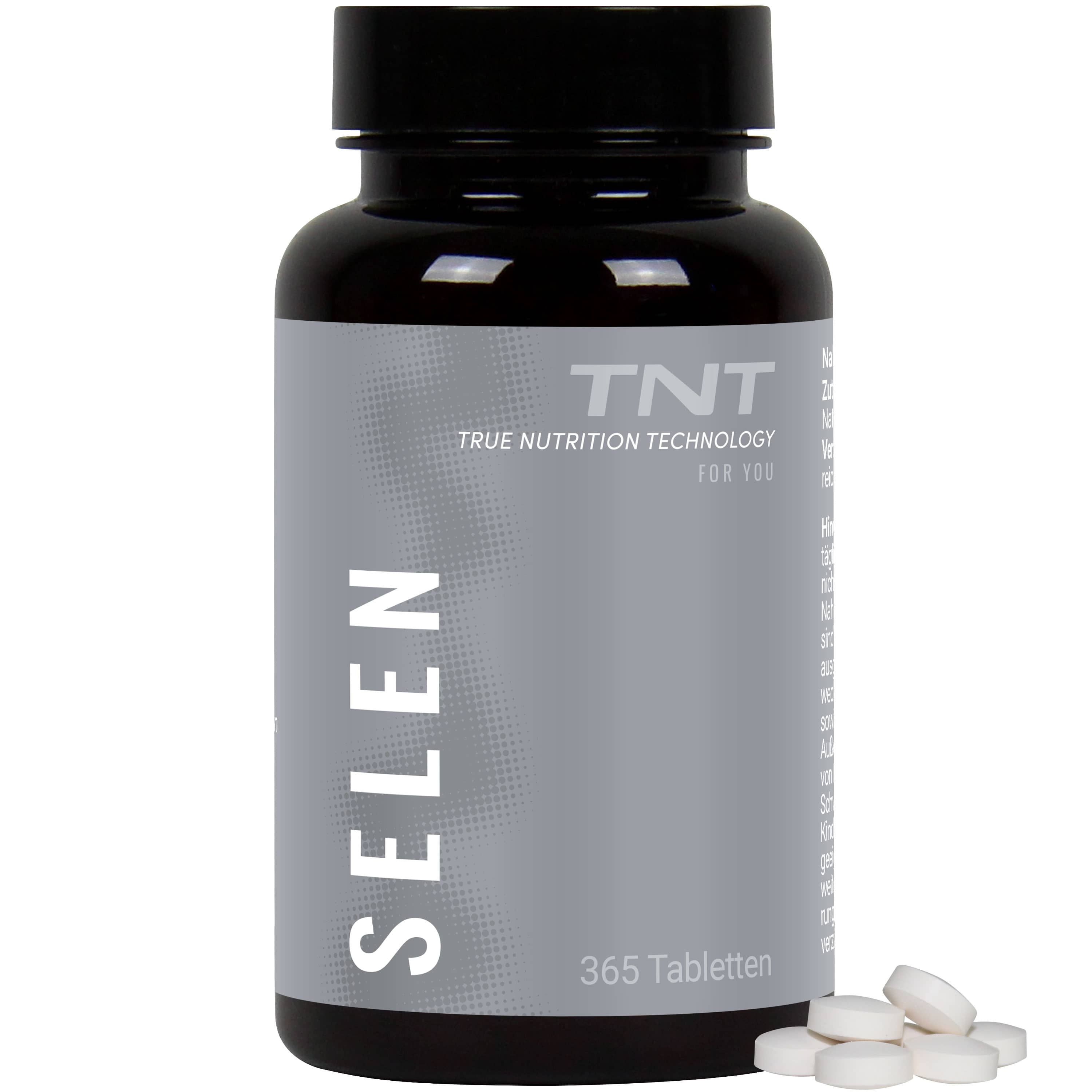 Braune Flasche mit weißen Tabletten. Aufschrift SELEN und TNT. 365 Tabletten. Tabletten liegen daneben.