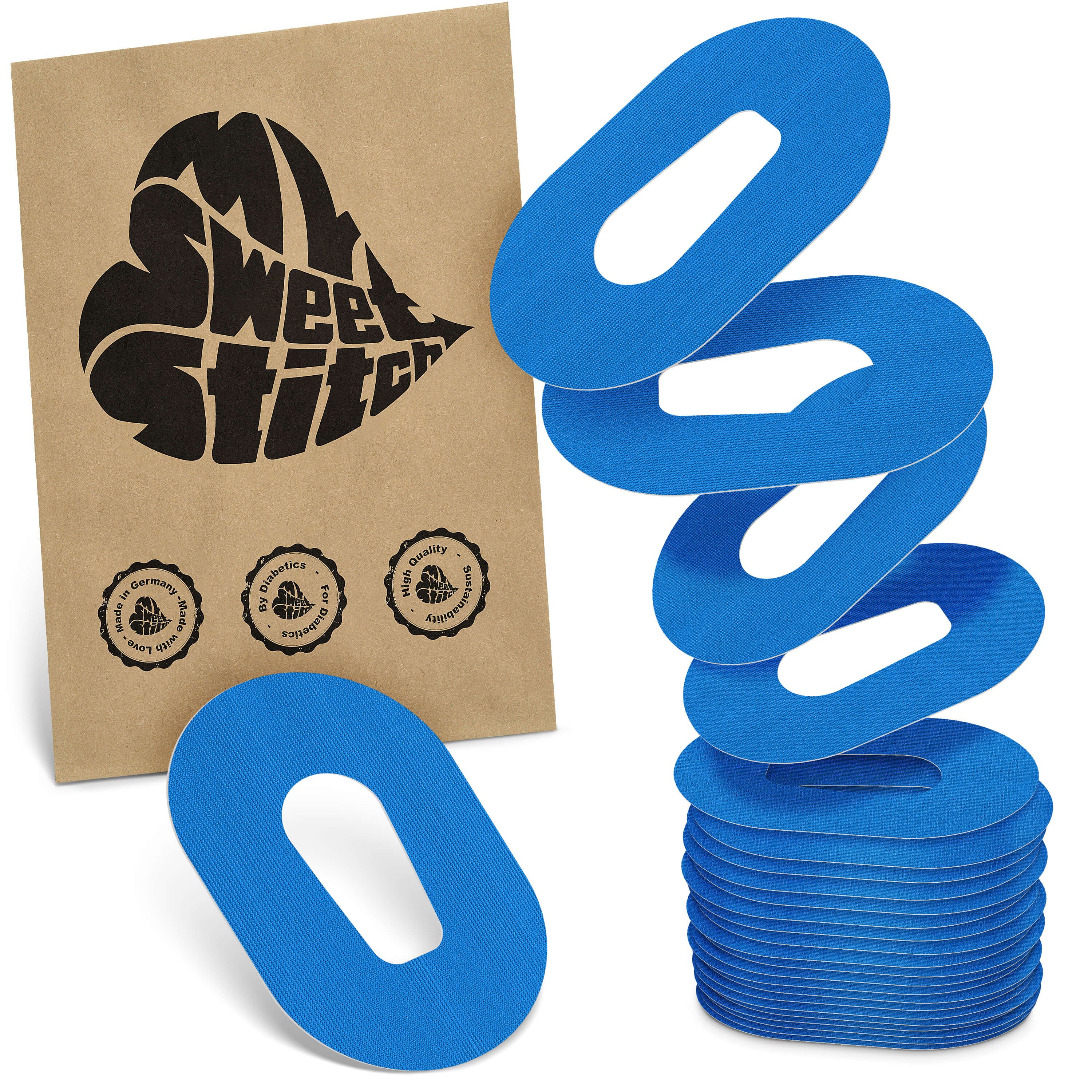 Blaue Pflaster mit ovaler Form und Aussparung. Braune Verpackung mit Logo und Siegeln.