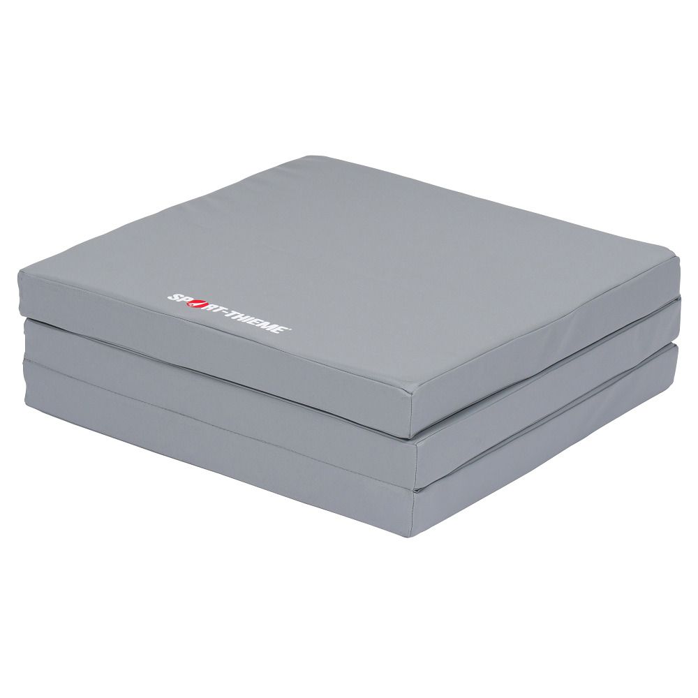 Graue, gefaltete Matte. Sport-Thieme Logo sichtbar.