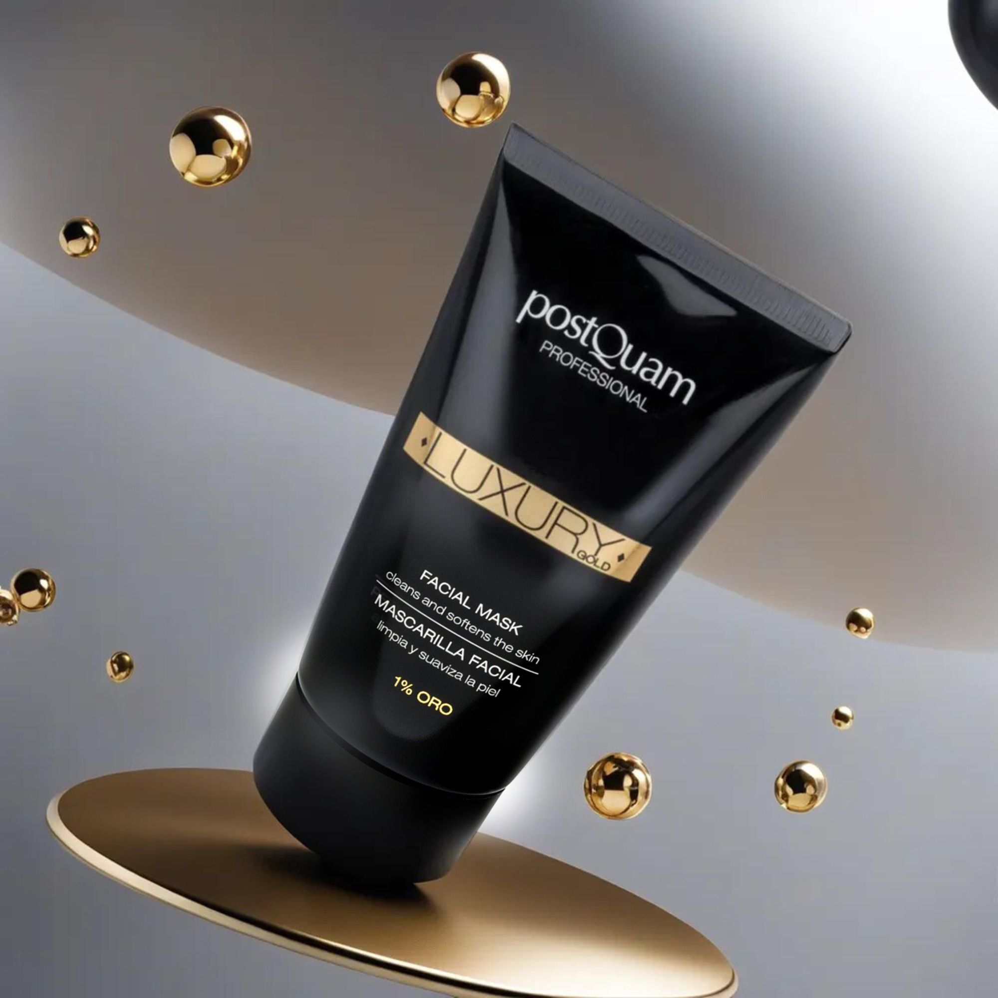 Schwarze Tube mit goldener Aufschrift. Text: Postquam Professional, Luxury Gold, Facial Mask, 1% Oro. Produkt auf goldener Plattform.