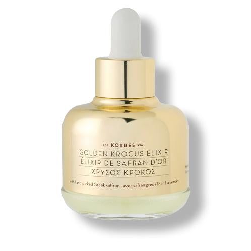 Goldene Flasche mit Pipette. Aufschrift: Golden Krocus Elixir. Text in Griechisch und Französisch. Mit Safran.
