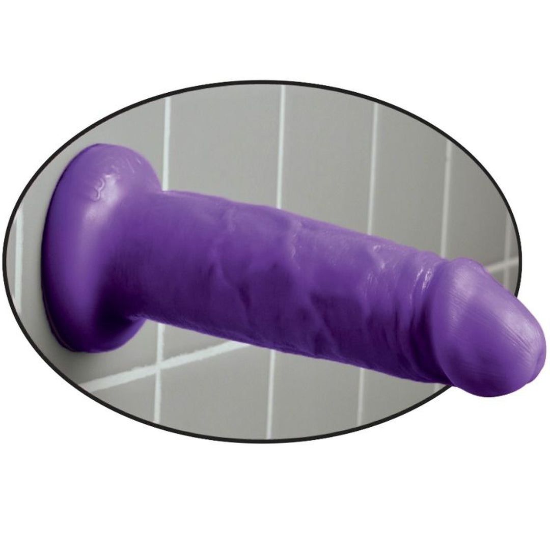 Lila Dildo an Wand. Ovaler Rahmen. Realistische Form, texturierte Oberfläche.