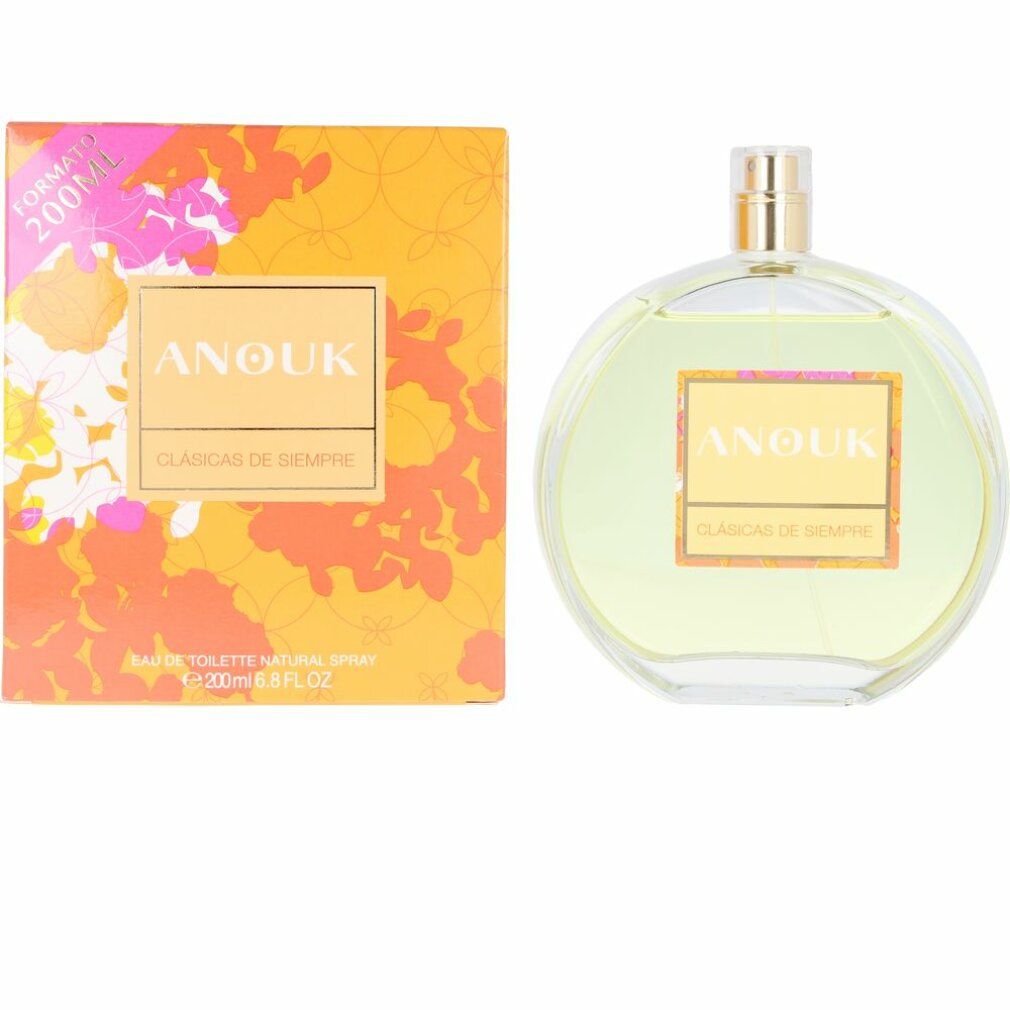 Anouk Eau De Toilette Spray. Runde Glasflasche mit gelblicher Flüssigkeit. Rechteckige Verpackung mit floralem Muster und Schriftzug.