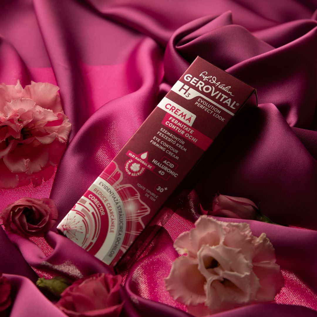 Verpackung und Rosen auf rosa Seide. Verpackung: Gerovital H3, Creme, Fermitate Contur Ochi. Text.