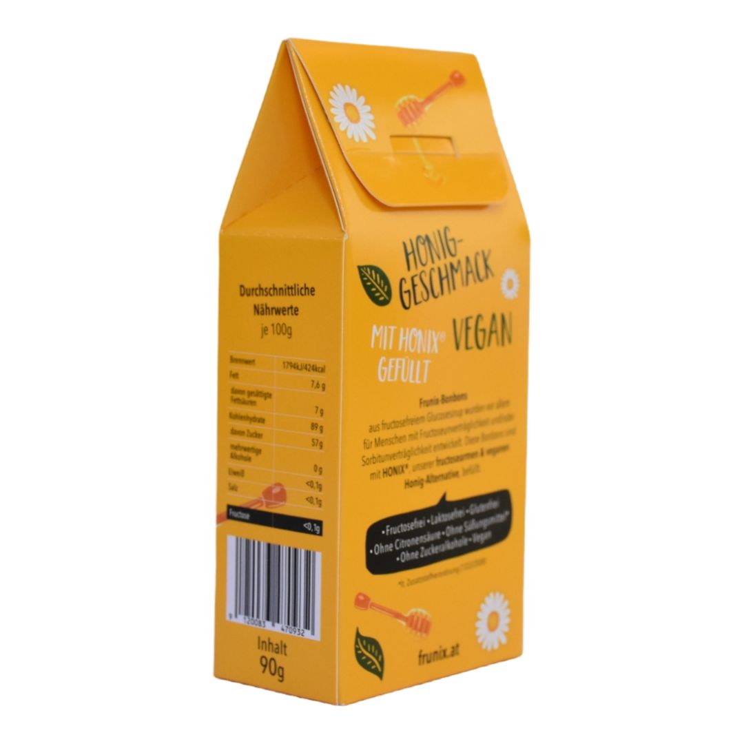 Gelbe Verpackung mit Honig-Geschmack. Aufschrift: MIT HONIX VEGAN GEFÜLLT. Enthält Nährwertangaben und Inhaltsangaben.