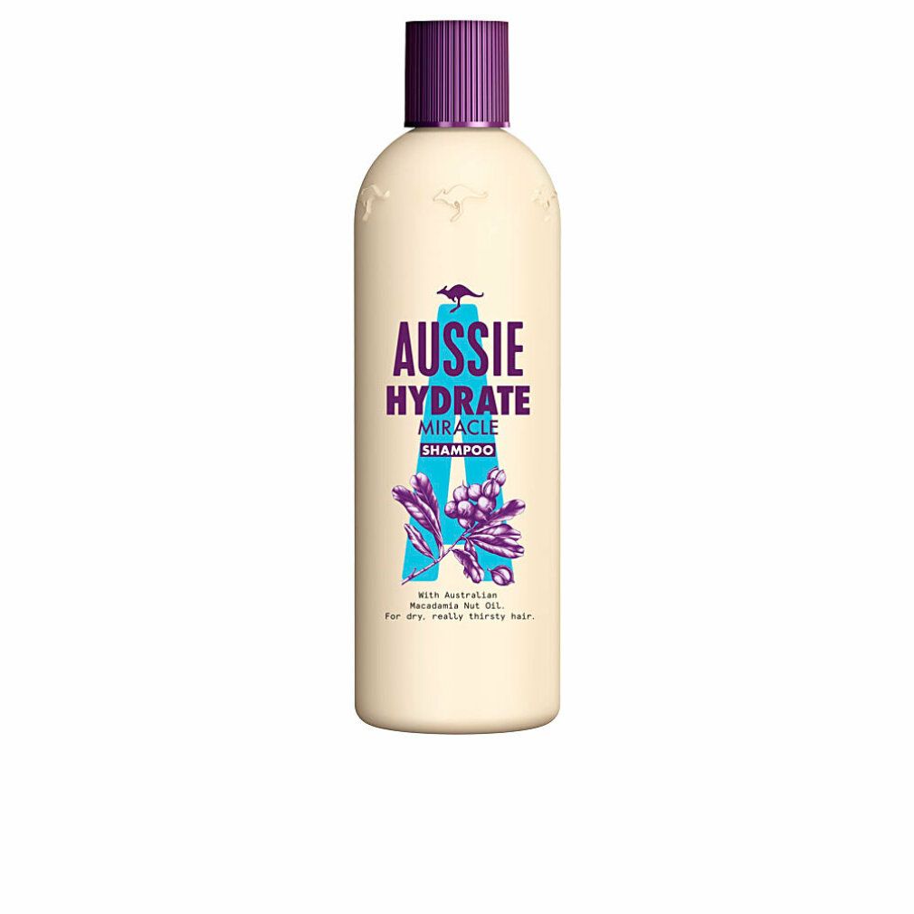 Beige Shampoo-Flasche mit lila Verschluss. Aufschrift: Aussie Hydrate Miracle Shampoo. Illustration mit Blättern und Beeren.