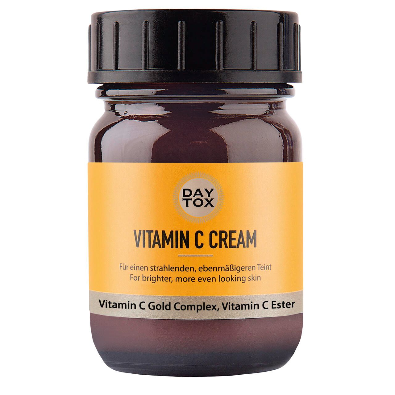 Braune Glasflasche mit schwarzem Deckel und gelbem Etikett. Aufschrift: Vitamin C Cream. Enthält Vitamin C Gold Complex und Vitamin C Ester.