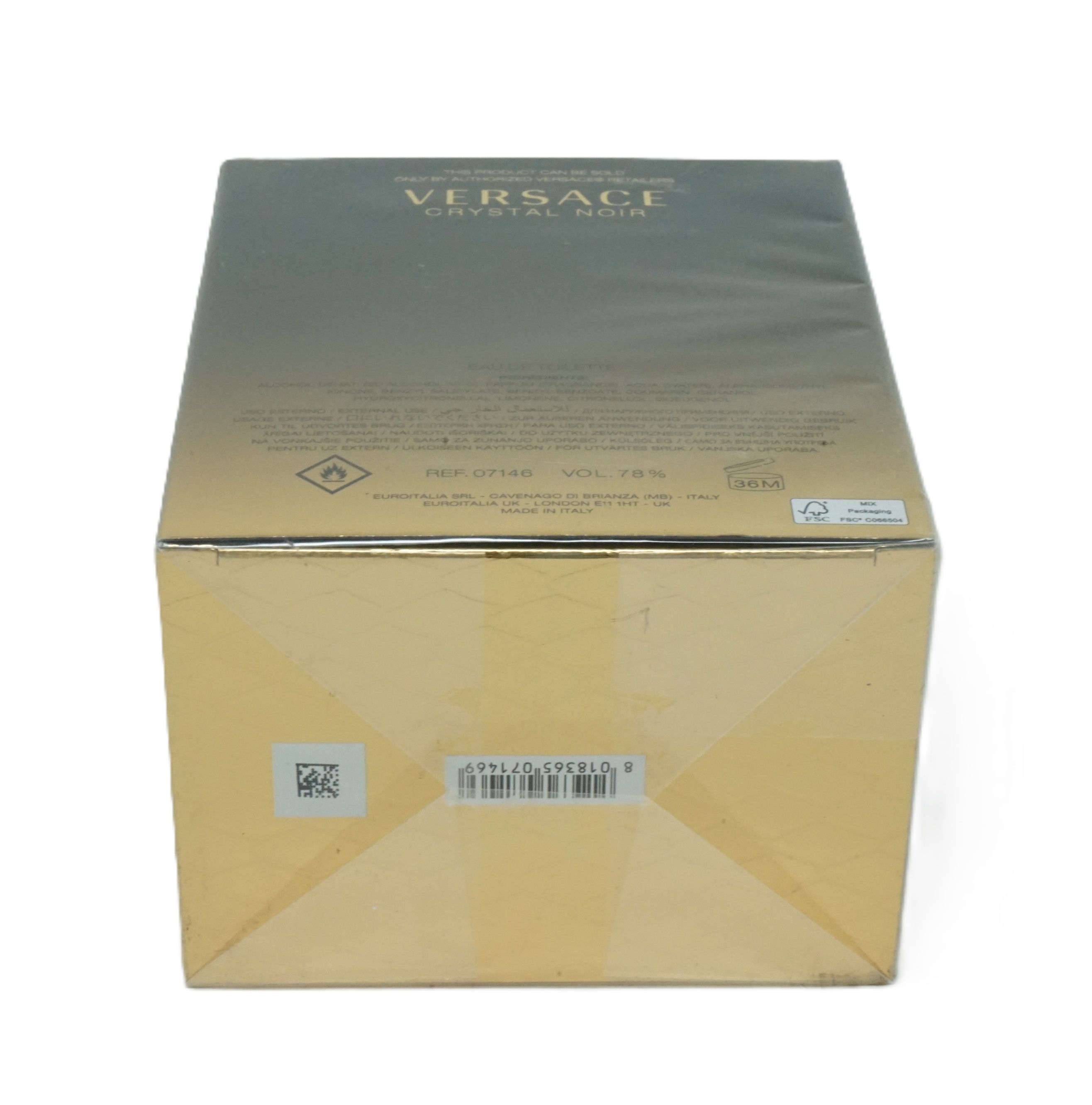 Versace Crystal Noir Verpackung. Schwarze Schachtel mit goldfarbenem Farbverlauf. Aufschrift: Versace Crystal Noir. Rückseite mit Text.