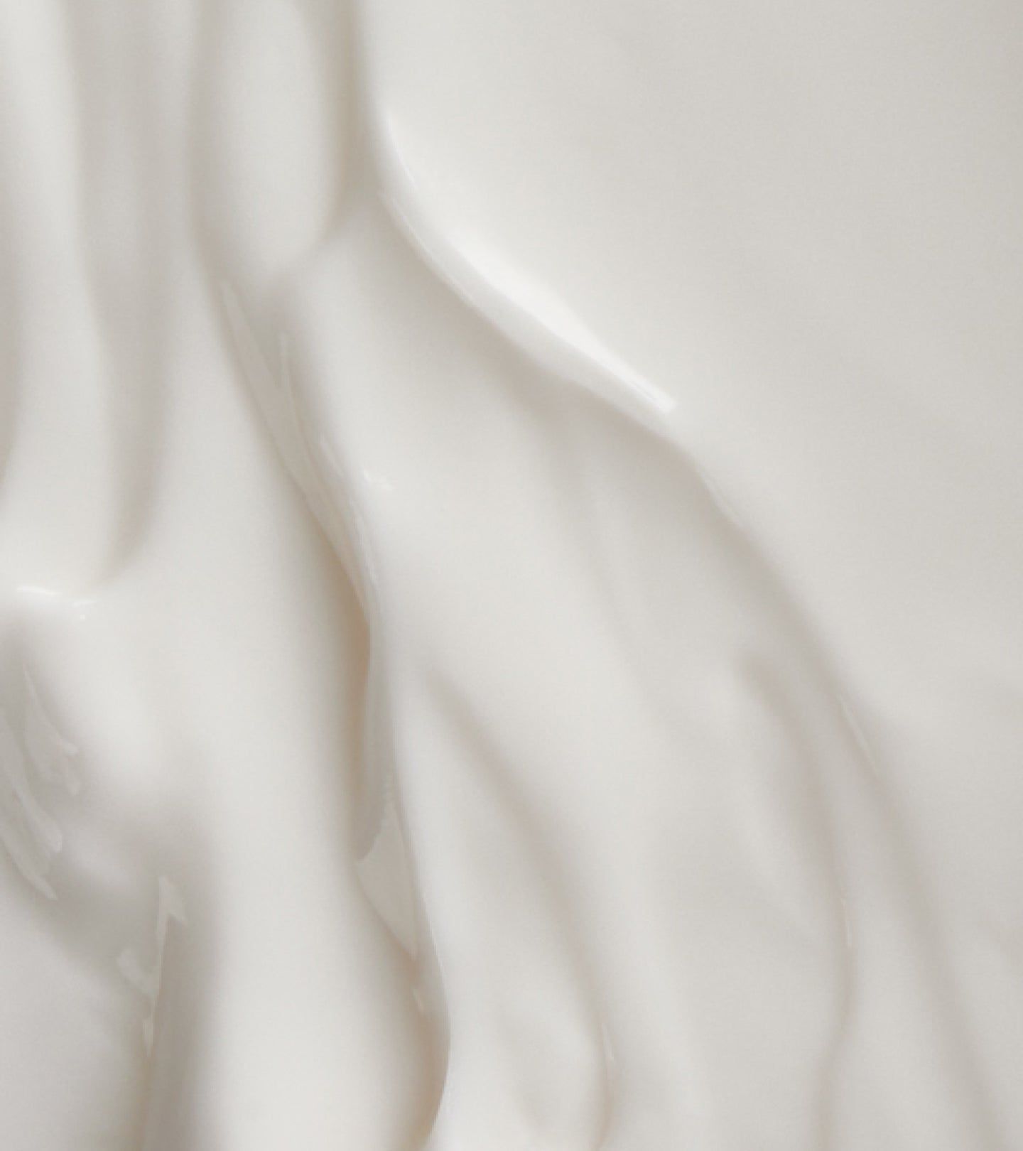 Abstrakte Textur einer weißen, cremigen Lotion.