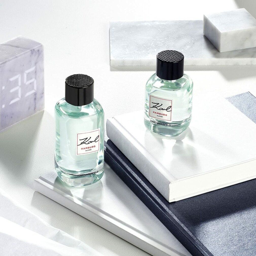 Zwei Karl Lagerfeld Hamburg Alster E.d.T. Nat. Spray Flakons. Aufschrift Karl und Hamburg Alster. Auf Büchern.