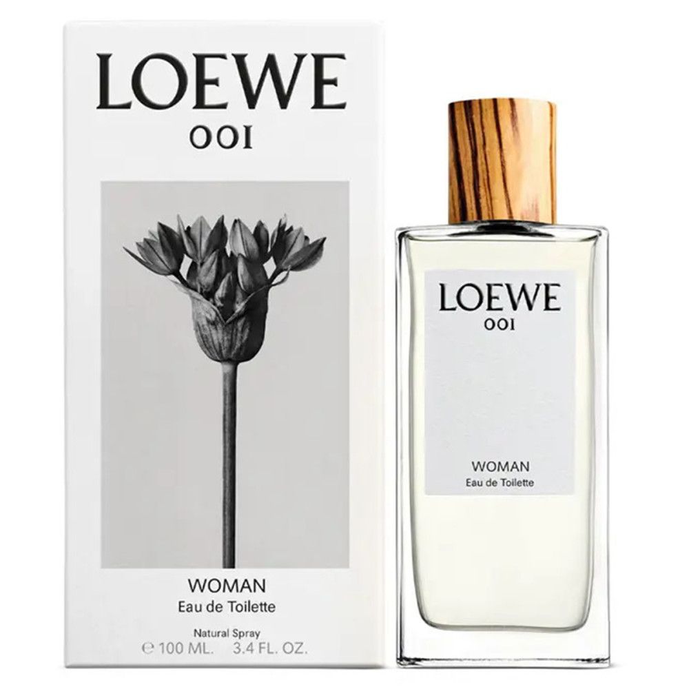 Loewe 001 Woman Eau de Toilette. Flakon und Verpackung. Flakon rechteckig mit Holzverschluss. Verpackung mit floralem Motiv.