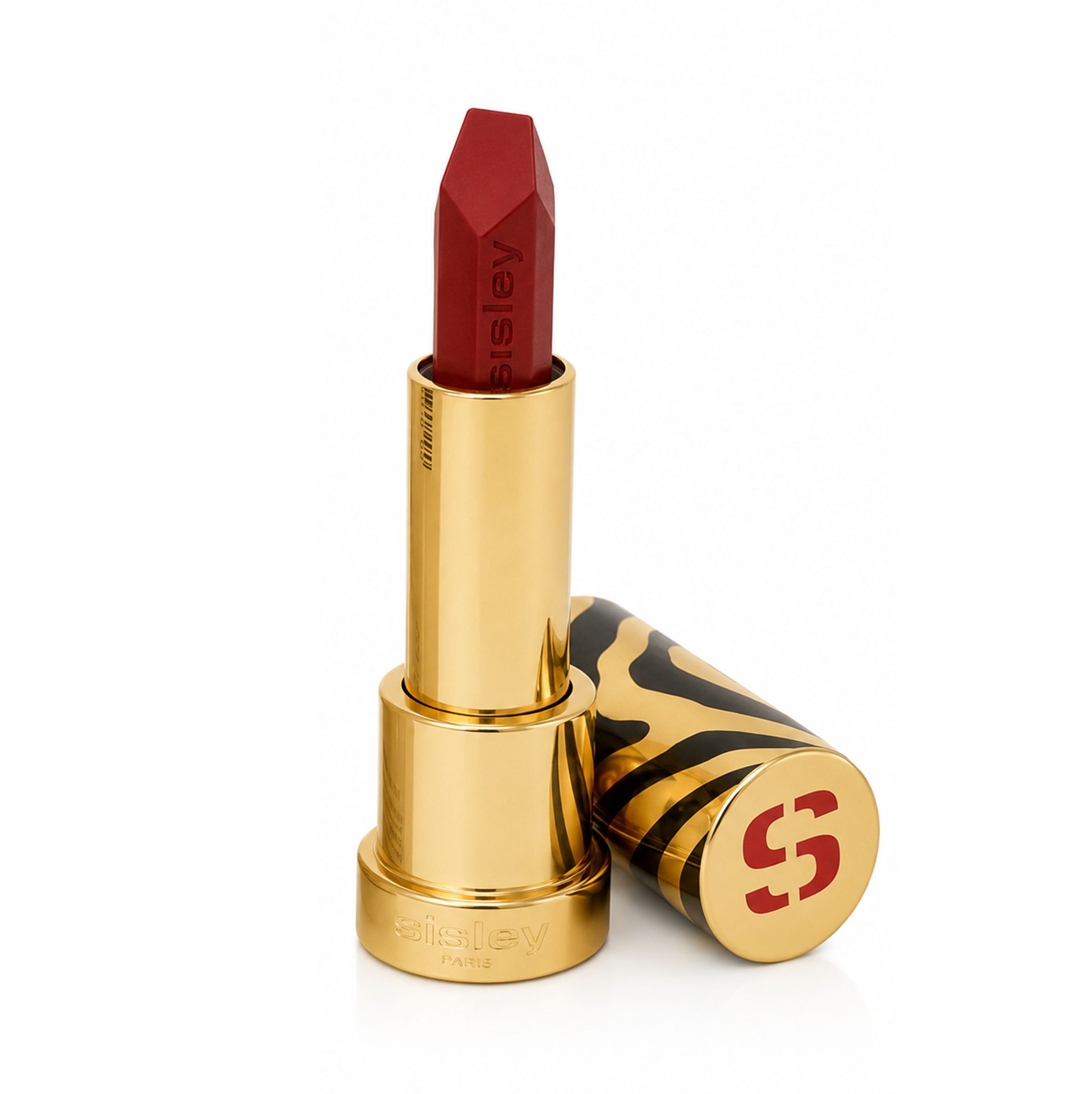 Sisley Le Phyto Rouge Lippenstift in Goldgehäuse mit Zebra-Muster-Kappe, roter Lippenstiftspitze.