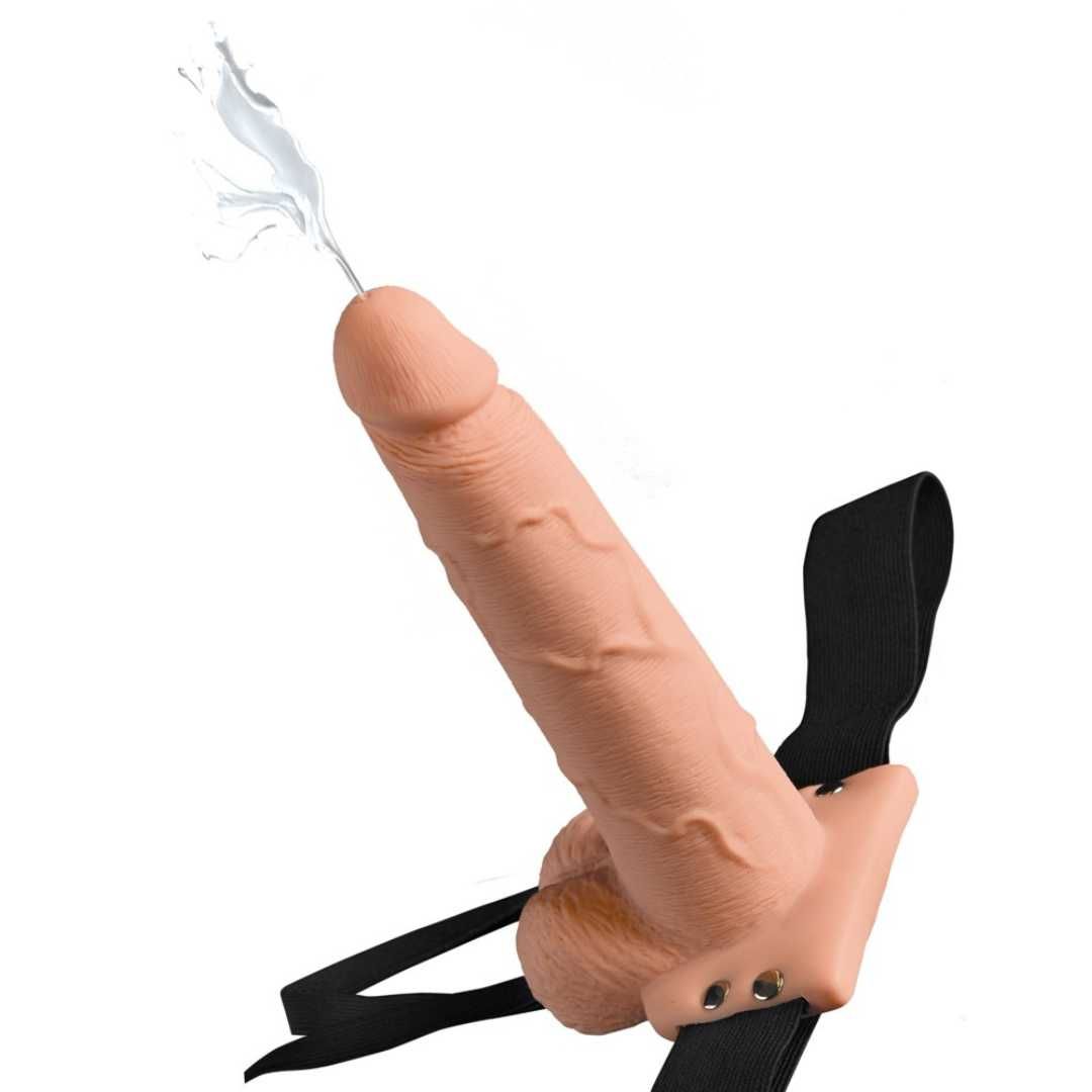 Beigefarbener Dildo mit Spritzfunktion und schwarzem Harness. Detailreiche Oberfläche, Spritzeffekt.