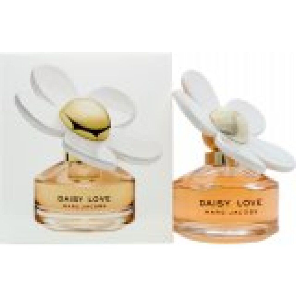 Zwei Parfümflakons mit weißer Blüte und goldenem Deckel. Aufschrift: DAISY LOVE MARC JACOBS.