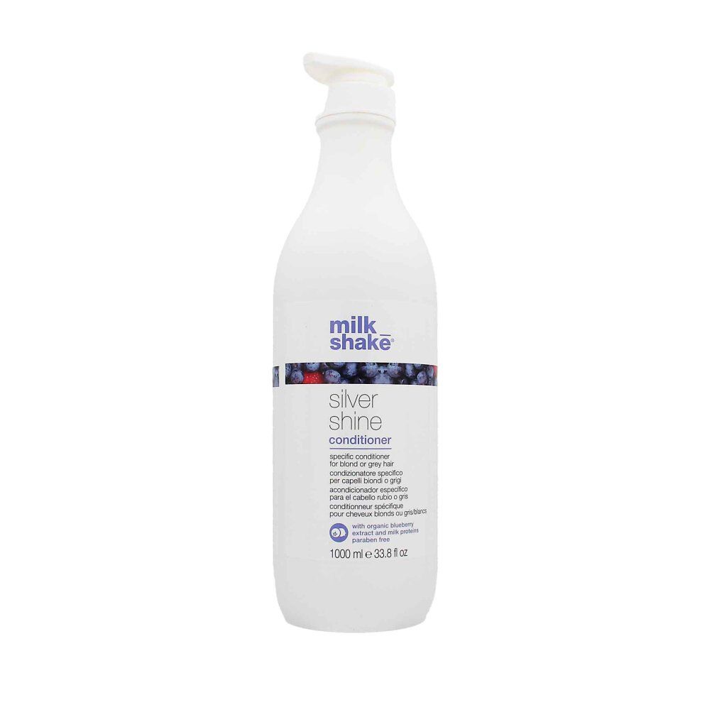 Weiße Flasche mit Pumpe. Aufschrift: milk_shake, Silver shine conditioner. Mit Blaubeerextrakt. 1000 ml.