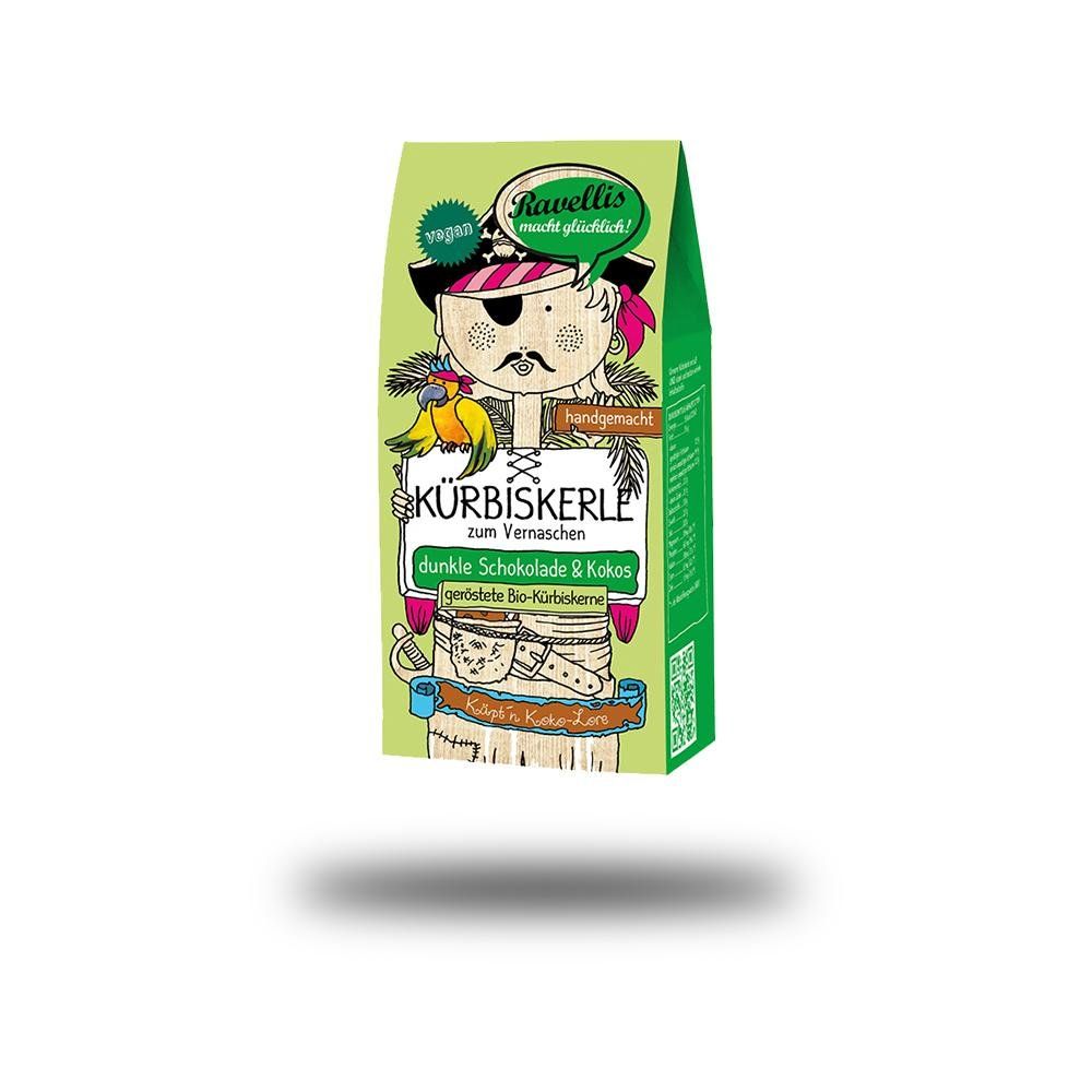 Verpackung von Ravellis Kürbiskernen. Grün, mit Piraten-Illustration und Text: Kürbiskerle, dunkle Schokolade & Kokos.