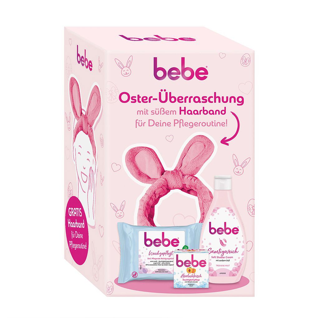 Rosa Geschenkbox mit bebe-Produkten: Reinigungstücher, Feuchtigkeitspflege, Soft Shower Cream und Haarband mit Hasenohren.