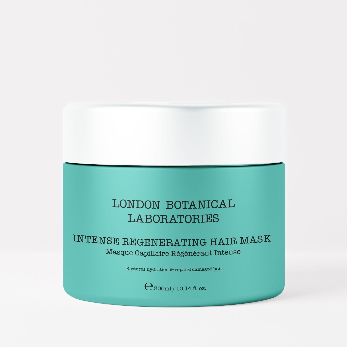 Turquoise pot met witte deksel. Opschrift: Intense Regenerating Hair Mask, Masque Capillaire Régénérant Intense. Merk: London Botanical Laboratories.