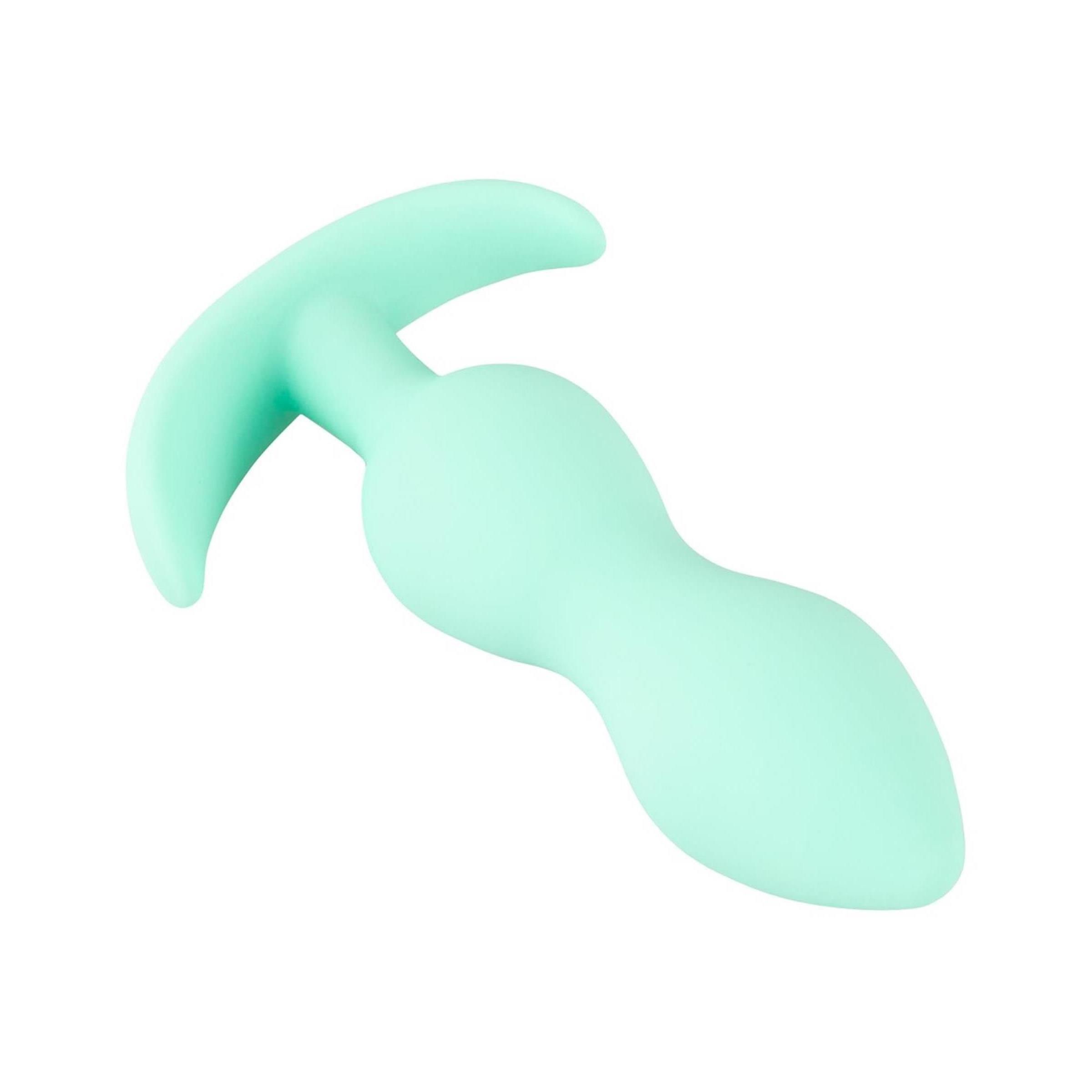 Hellgrüner Analplug mit tropfenförmigem Kopf und gebogener Basis. Glatte Oberfläche.