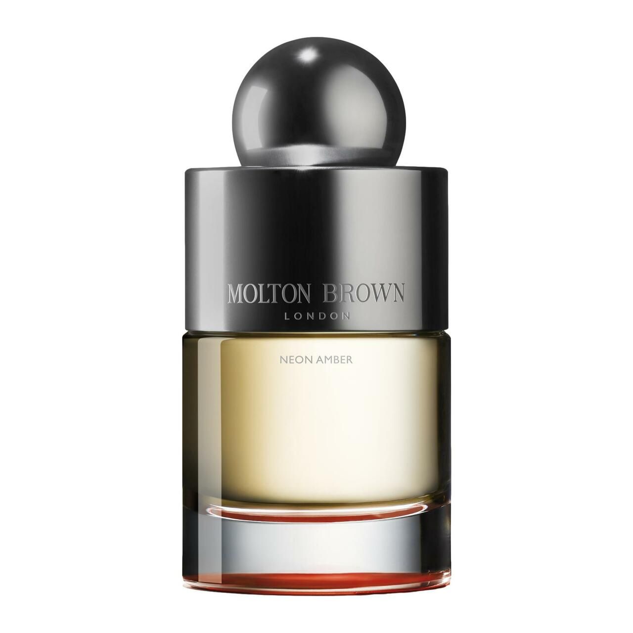 Flakon mit silbernem Deckel und Kugel. Aufschrift: Molton Brown, Neon Amber. Flüssigkeit bernsteinfarben.
