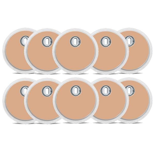 Zehn runde, beige Aufkleber mit zentraler Öffnung. Weißer Rand. Für medizinische Geräte.