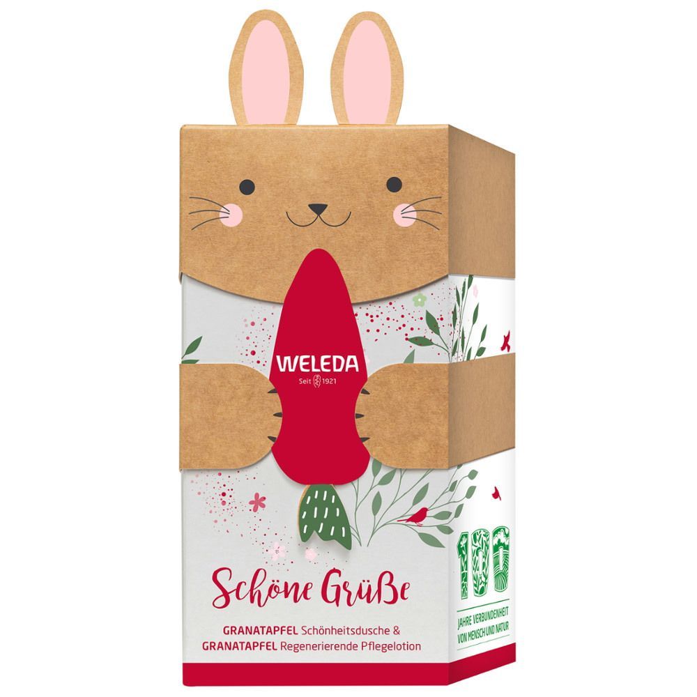 Kartonverpackung mit Hasenmotiv. Enthält WELEDA-Produkte. Aufschrift: Schöne Grüße, Granatapfel. 100 Jahre Verbundenheit.