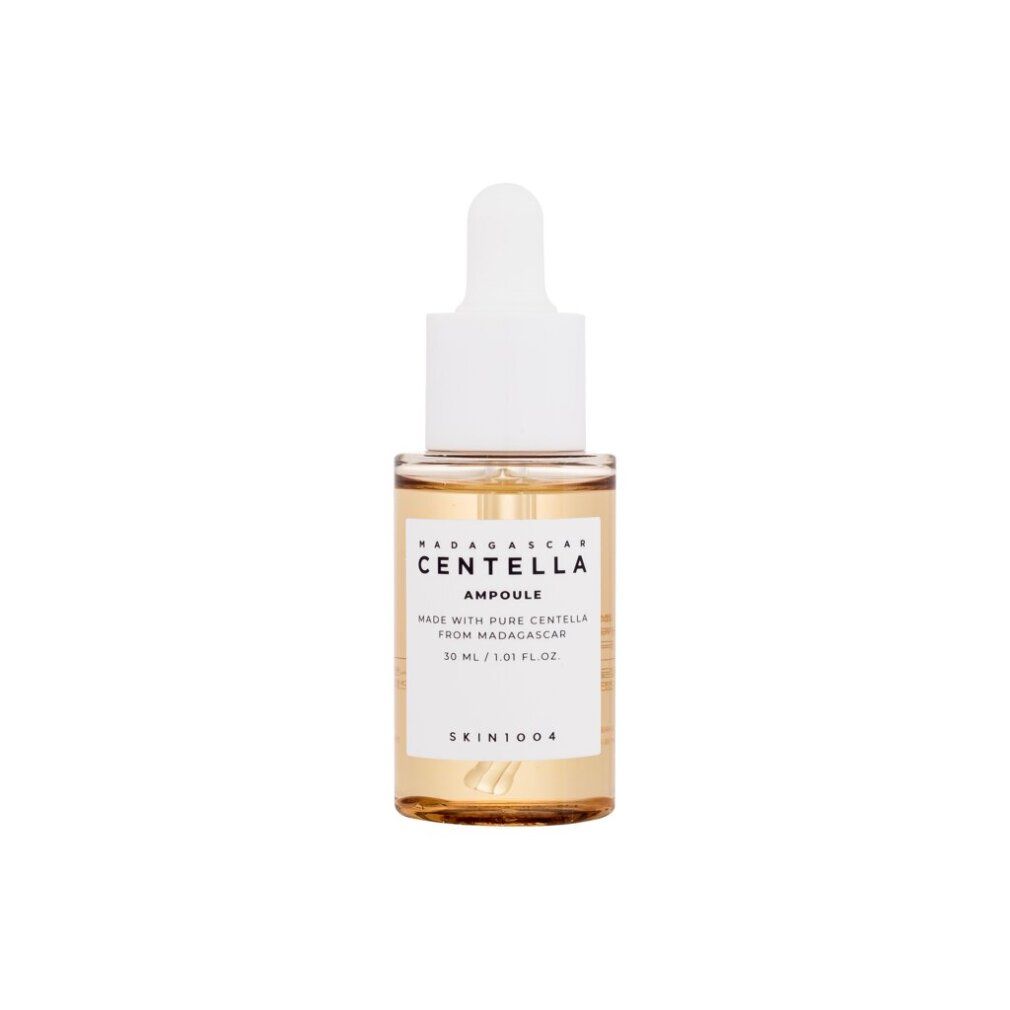 Flasche mit Pipette, enthält eine klare, goldene Flüssigkeit. Etikett zeigt 'Centella Ampoule' und 'Skin1004'.