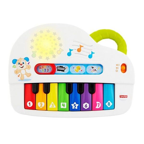 Weißes Spielzeug-Keyboard mit bunten Tasten. Mit Griff, Knöpfen und einem Cartoon-Hund. Das Keyboard hat die Marke Fisher Price.