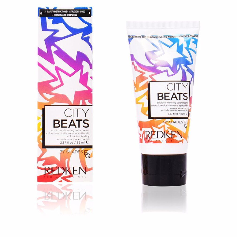 Farbcreme-Tube und Schachtel. Aufdruck: CITY BEATS, REDKEN. Farbverlauf-Design mit Sternen. Schwarzer Tubenverschluss.