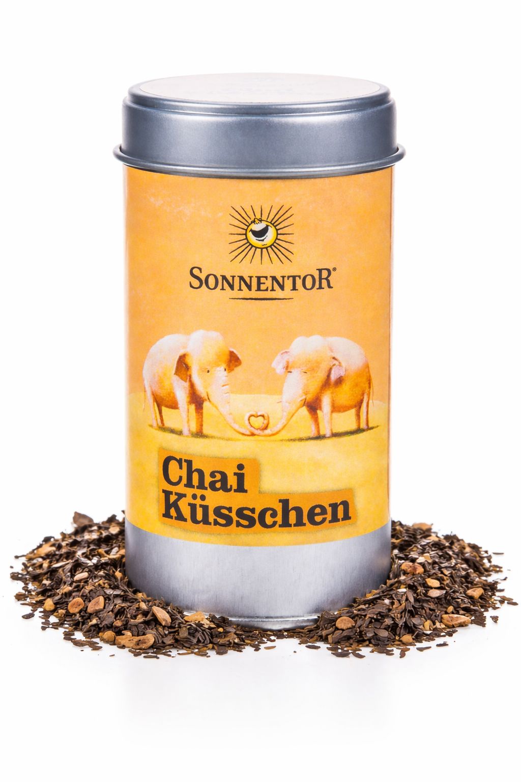 Sonnentor Chai Küsschen Dose umgeben von Chai-Gewürzmischung.