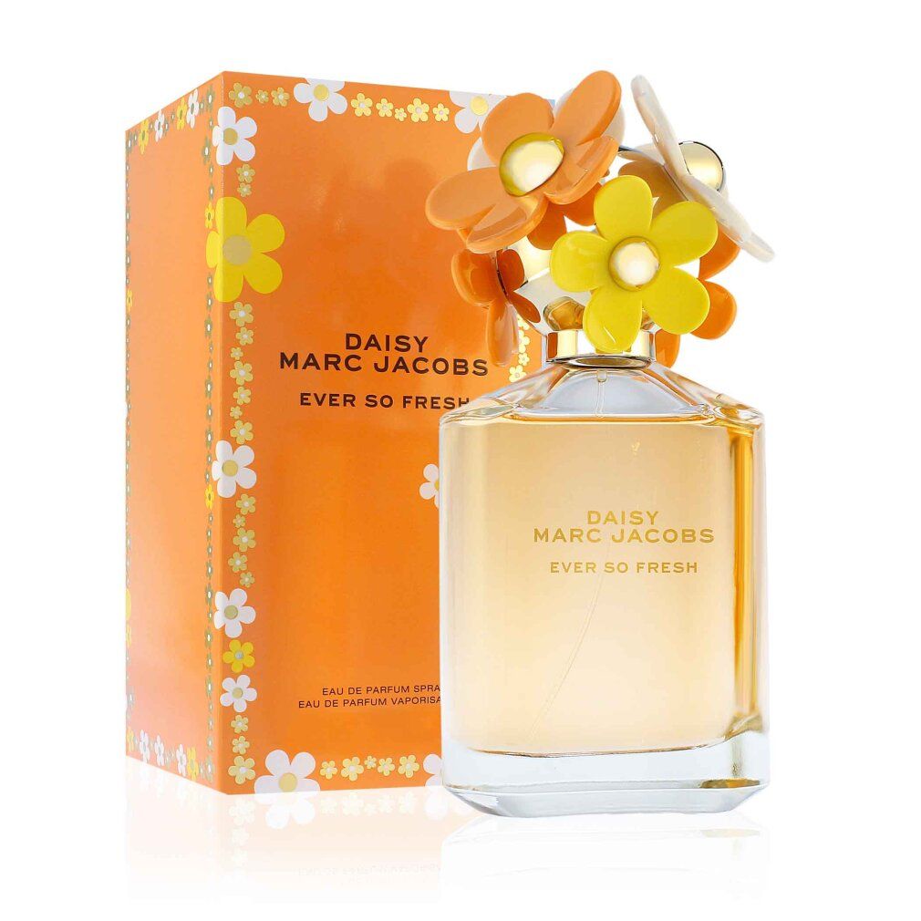 Parfümflakon und Verpackung. Flakon mit Blüten auf dem Deckel. Verpackung orange mit weißen und gelben Blüten. Aufschrift: Daisy Marc Jacobs.