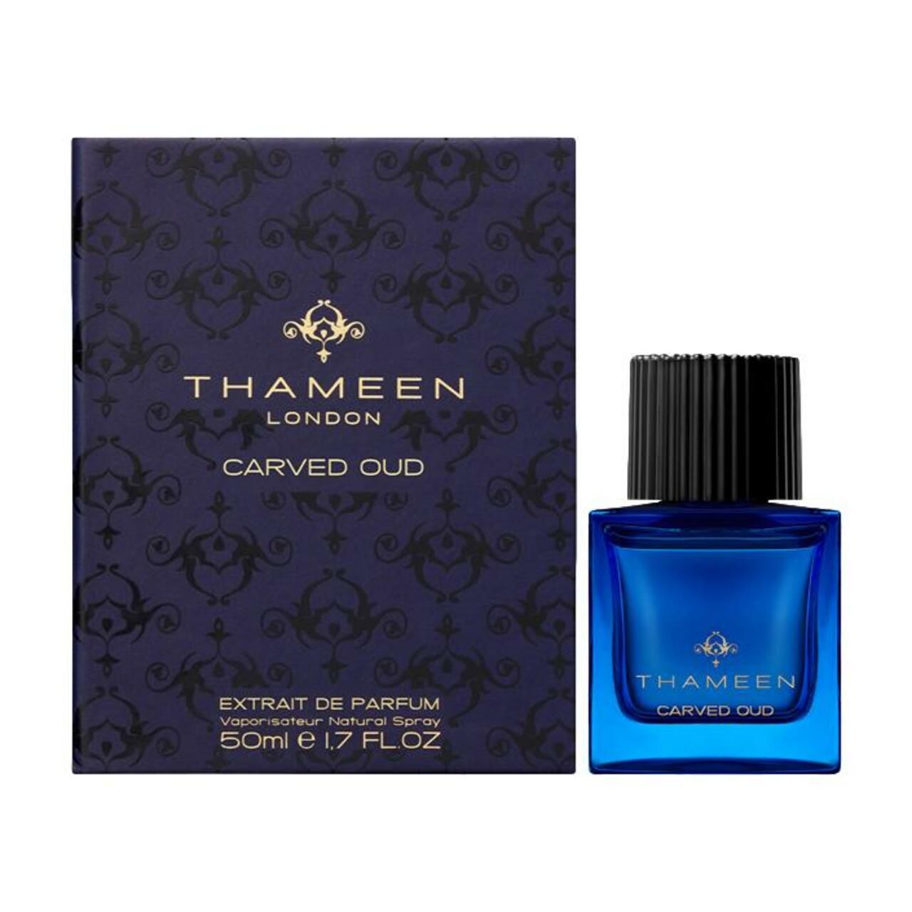 Blauer Flakon und Schachtel. Aufschrift: Thameen London, Carved Oud. Schachtel mit Muster.