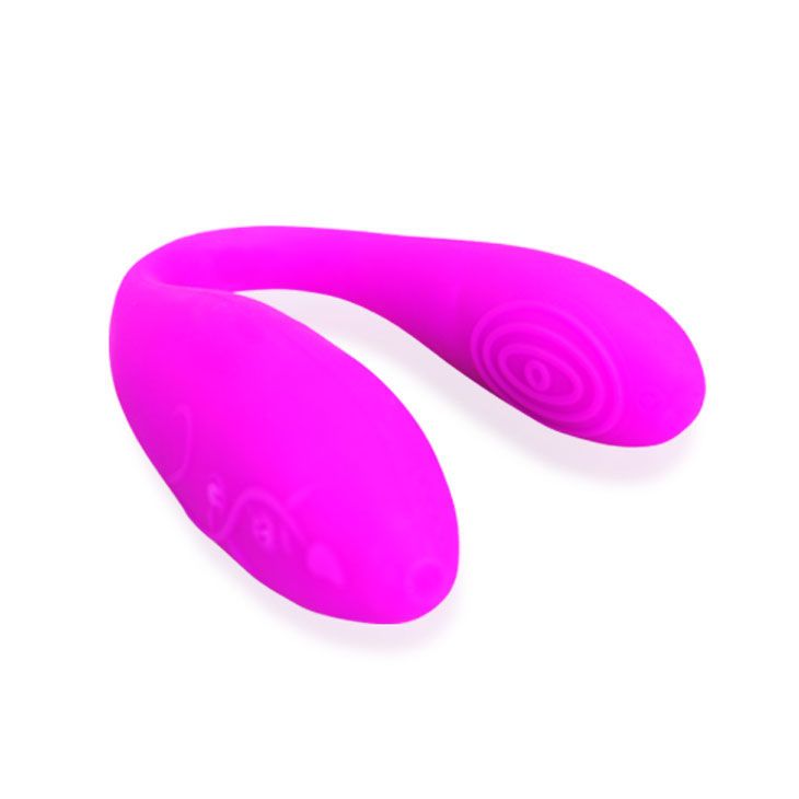 Pinkfarbenes, U-förmiges Produkt mit geriffelter Oberfläche an einem Ende.