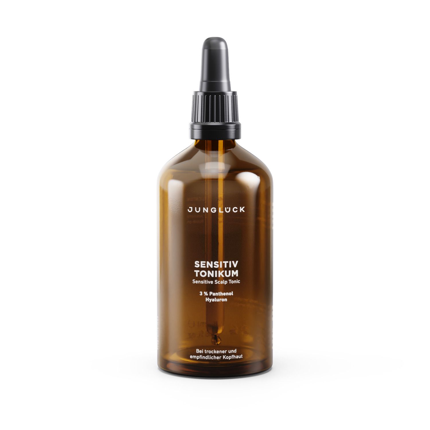 Braune Glasflasche mit schwarzem Verschluss und Pipette. Beschriftung: JUNGLÜCK, SENSITIV TONIKUM, 3% Panthenol Hyaluron. Bei trockener und empfindlicher Kopfhaut.