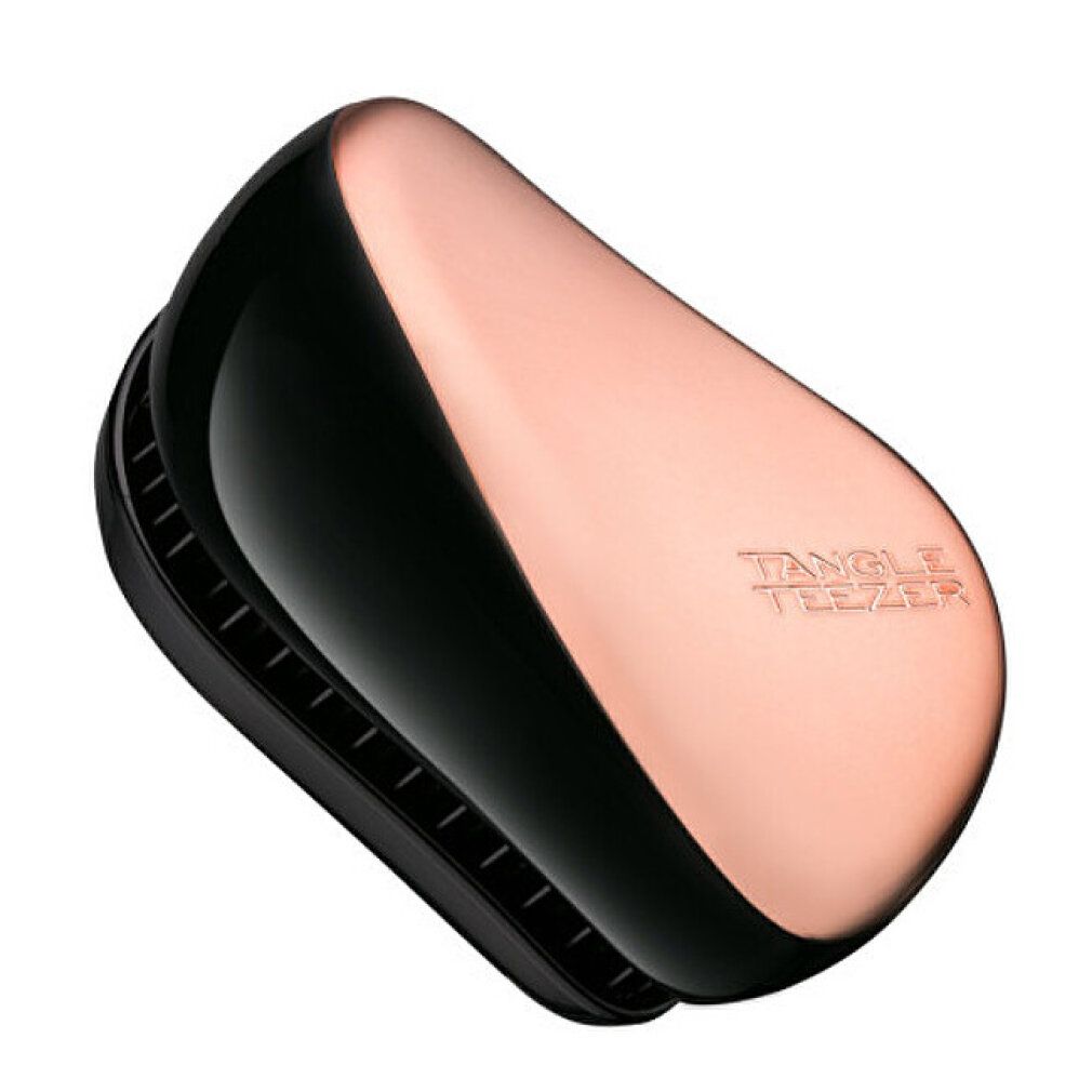 Kompakte Haarbürste, schwarz und kupferfarben. Geprägt: Tangle Teezer.
