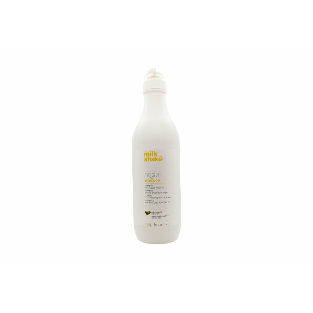 Weiße Flasche mit gelbem Etikett. Aufschrift: Milk_shake argan shampoo. Mit Arganöl. 1000 ml.