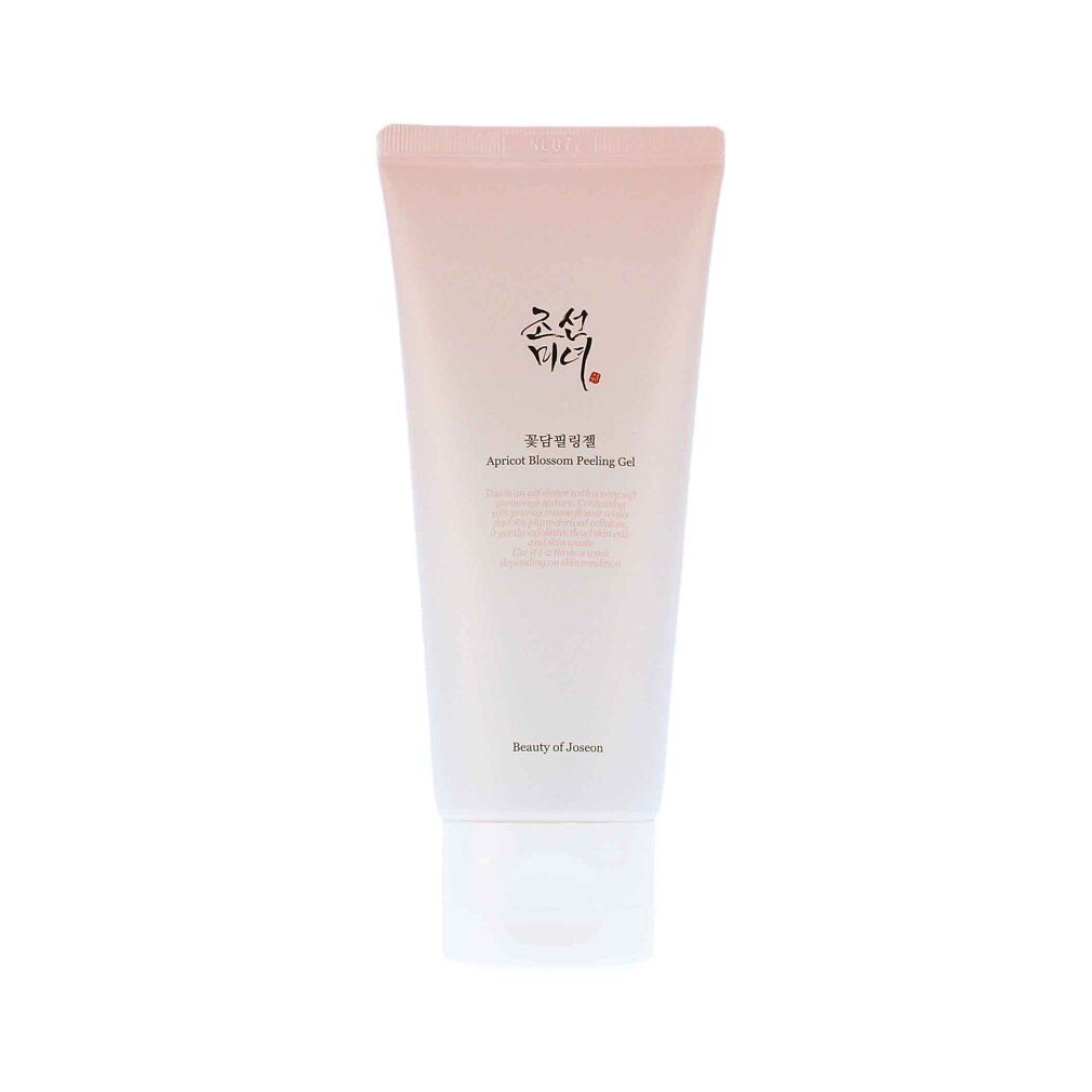 Weiße Tube. Text: Apricot Blossom Peeling Gel. Marke: Beauty of Joseon. Auf rosa Hintergrund.