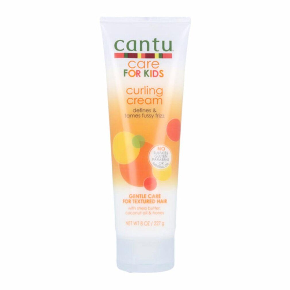 Cantu Care For Kids Curling Cream Tube. Weiß, mit farbigen Grafiken und Text. Enthält Shea Butter, Kokosnussöl und Honig.