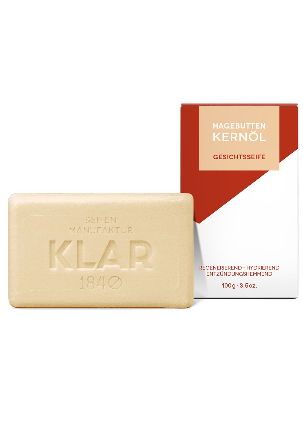 Beige Seife mit geprägtem Schriftzug KLAR und Verpackung. Auf der Verpackung steht Hagebutten Kernöl Gesichtsseife.