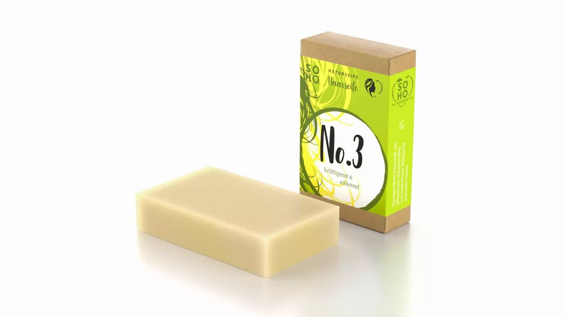 Seife und Verpackung. Seife neben der Verpackung. Verpackung mit Text: No.3, Naturseife.