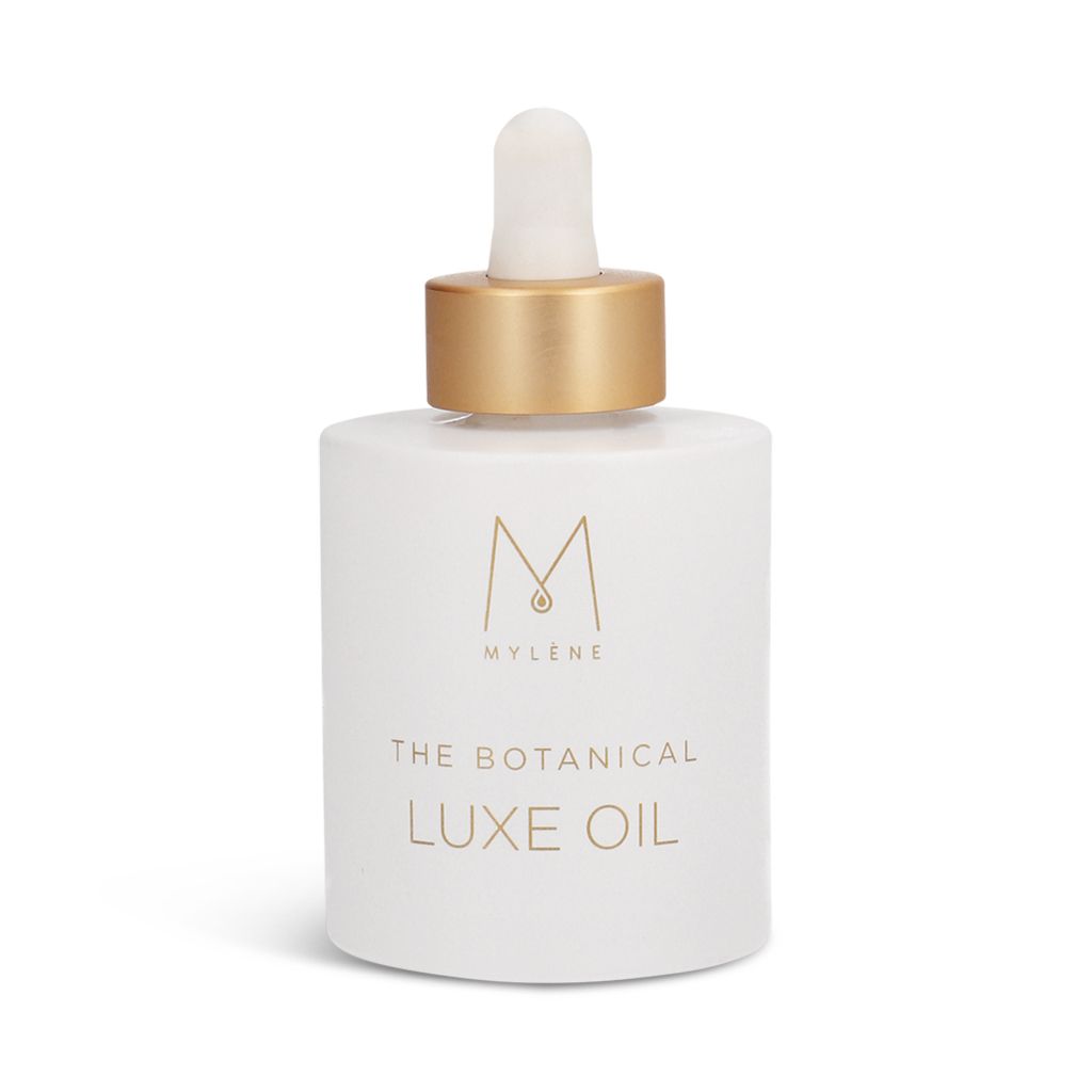Weiße Flasche mit goldfarbenem Verschluss und Pipette. Aufschrift: MYLÈNE, THE BOTANICAL LUXE OIL. Logo.