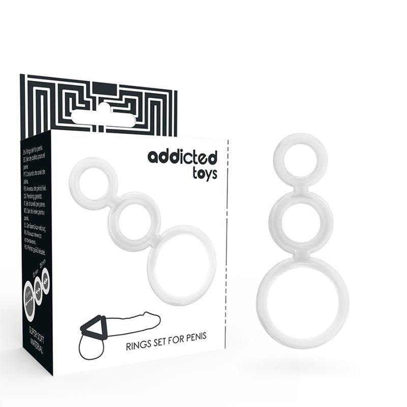 Ein Set aus drei weißen Penisringen aus weichem Material, verbunden in einer Kette. Verpackung mit "addicted toys" Logo und Produktbezeichnung.