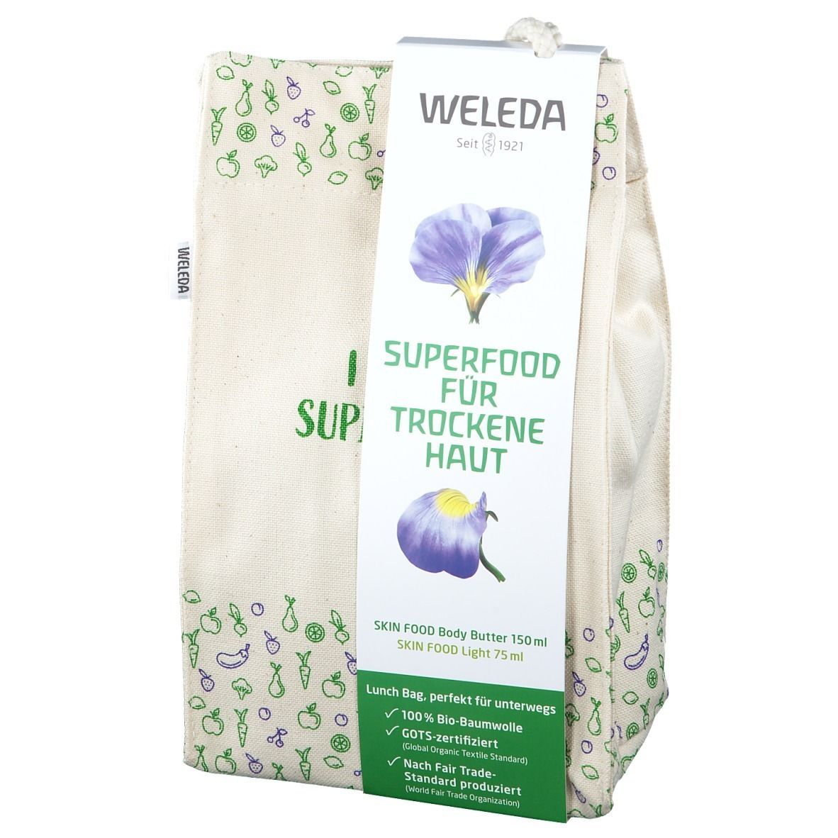 Beige Stofftasche mit Aufdrucken und Anhänger. Aufschrift: SUPERFOOD FÜR TROCKENE HAUT. Marke: WELEDA.